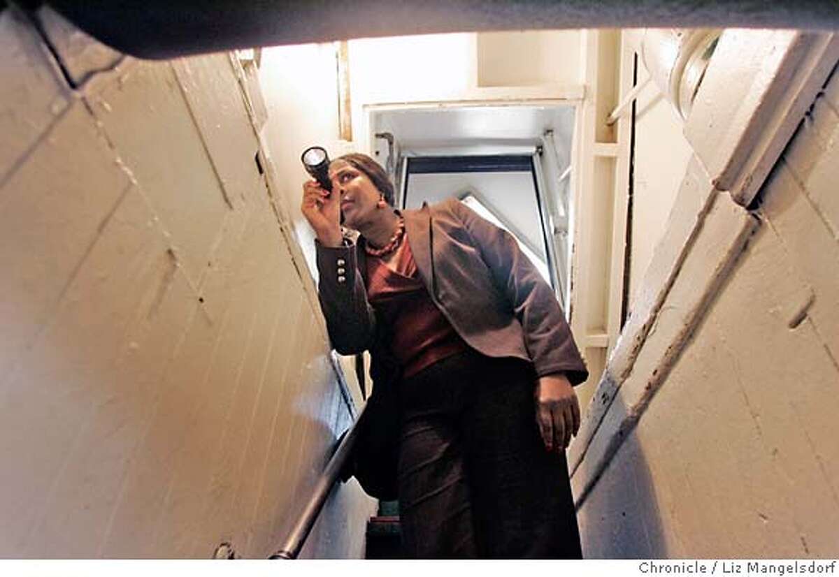Jacqueline Creenwood, Senior Environmental Health Inspector for the SF Department of Health, inspects a storage area of the restaurant Calzone's on Columbus in San Francsico on Jan. 23, 2007. Calzone's got a very good health review. Photo by Liz Mangelsdorf/ San Francisco Chronicle