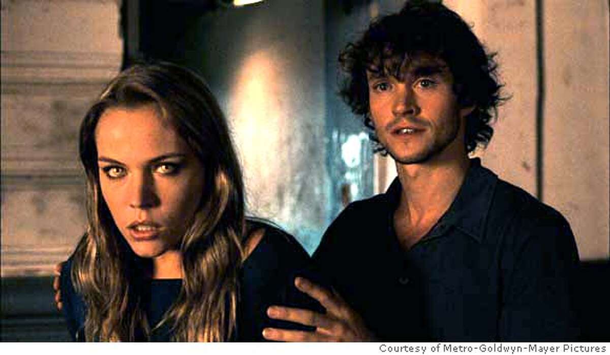 PHOTOGRAPHER: Courtesy of Metro-Goldwyn-Mayer Pictures, Inc. � 2006 Lakeshore Entertainment. All Rights Reserved AGNES BRUCKNER stars as Vivian and HUGH DANCY stars as Aiden in the werewolf thriller BLOOD & CHOCOLATE distributed by Metro-Goldwyn-Mayer Distribution Co., A Division of Metro-Goldwyn-Mayer Studios Inc. Photo Credit: Courtesy of Metro-Goldwyn-Mayer Pictures, Inc. Copyright � 2006 Lakeshore Entertainment. All Rights Reserved. Ran on: 01-27-2007 Mixed marriage: Agnes Bruckner is a werewolf and Hugh Dancy isnt, in Blood & Chocolate.