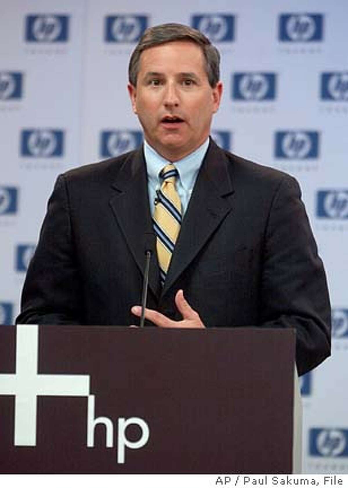 ** FILE ** Co. chief executive Mark Hurd gestures during a news conference at HP headquarters in Palo Alto, Calif., Wednesday, March 30, 2005. Computer maker Co. on Tuesday, July 19, 2005, said it will cut 14,500 jobs, about 10 percent of its full-time staff, as part of a restructuring plan designed to save $1.9 billion annually and boost business performance. "After a thorough review of our business, we have formulated a plan that will enable HP to begin delivering its full potential," Hurd said in a statement Tuesday. (AP Photo/Paul Sakuma)