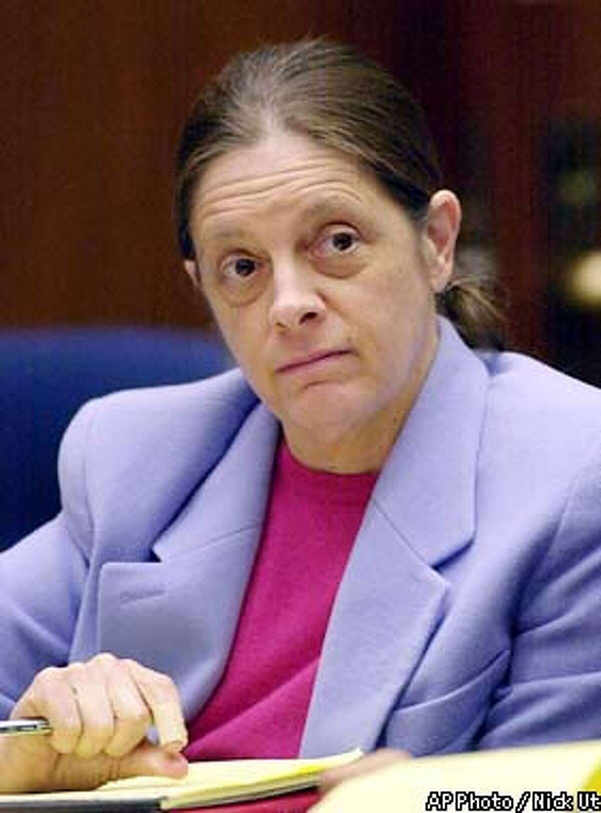 Chief defendant Marjorie Knoller listens to closing arguments in the San Francisco dog mauling trial Monday, March 18, 2002, at the Los Angeles County Courthouse in Los Angeles. Knoller, who was present when two dogs she and her husband kept attacked neighbor Diane Whipple in a hallway of their San Francisco apartment building on Jan. 26, 2001, is charged with second-degree murder. Knoller, 46, and her husband Robert Noel, 60, are both charged with involuntary manslaughter and keeping a mischievous dogthat killed a person. (AP Photo/Nick Ut, Pool)