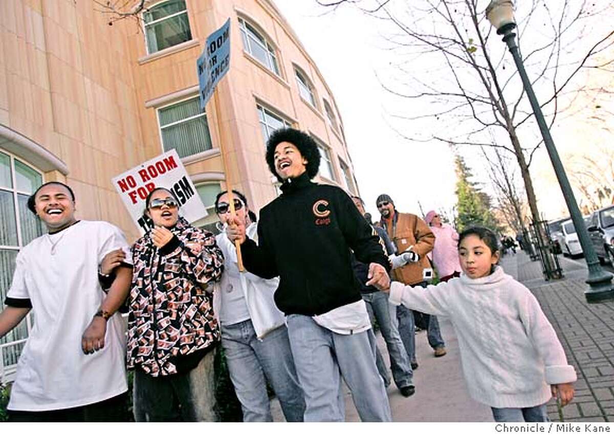 Uiliami Fihaki, 18 of Hayward, marches with friends while holding the hand of his cousin Uaine Fihaki, 5, also of Hayward, during a Martin Luther King march and rally at City Hall Plaza in Hayward, CA, on Monday, January, 15, 2007. photo taken: 1/15/07 Mike Kane / The Chronicle ** Uiliami Fihaki, Uaine Fihaki