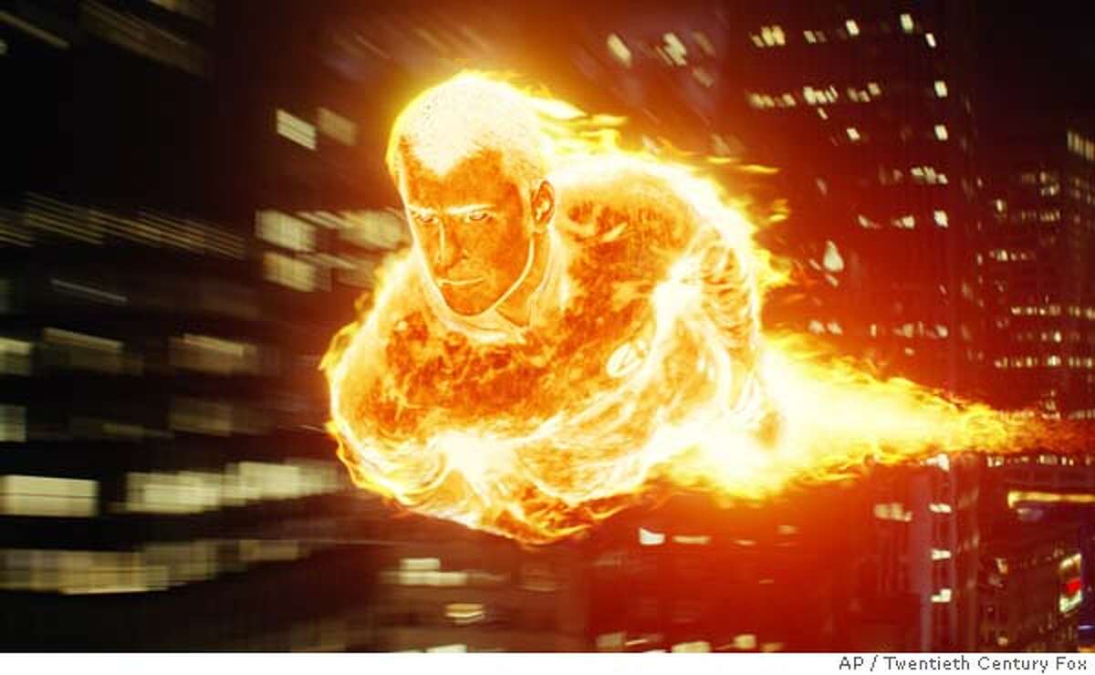 In this photo provided by Twentieth Century Fox, The Human Torch (Chris Evans) flames on above the streets of New York City in "The Fantastic Four." (AP Photo/Twentieth Century Fox).