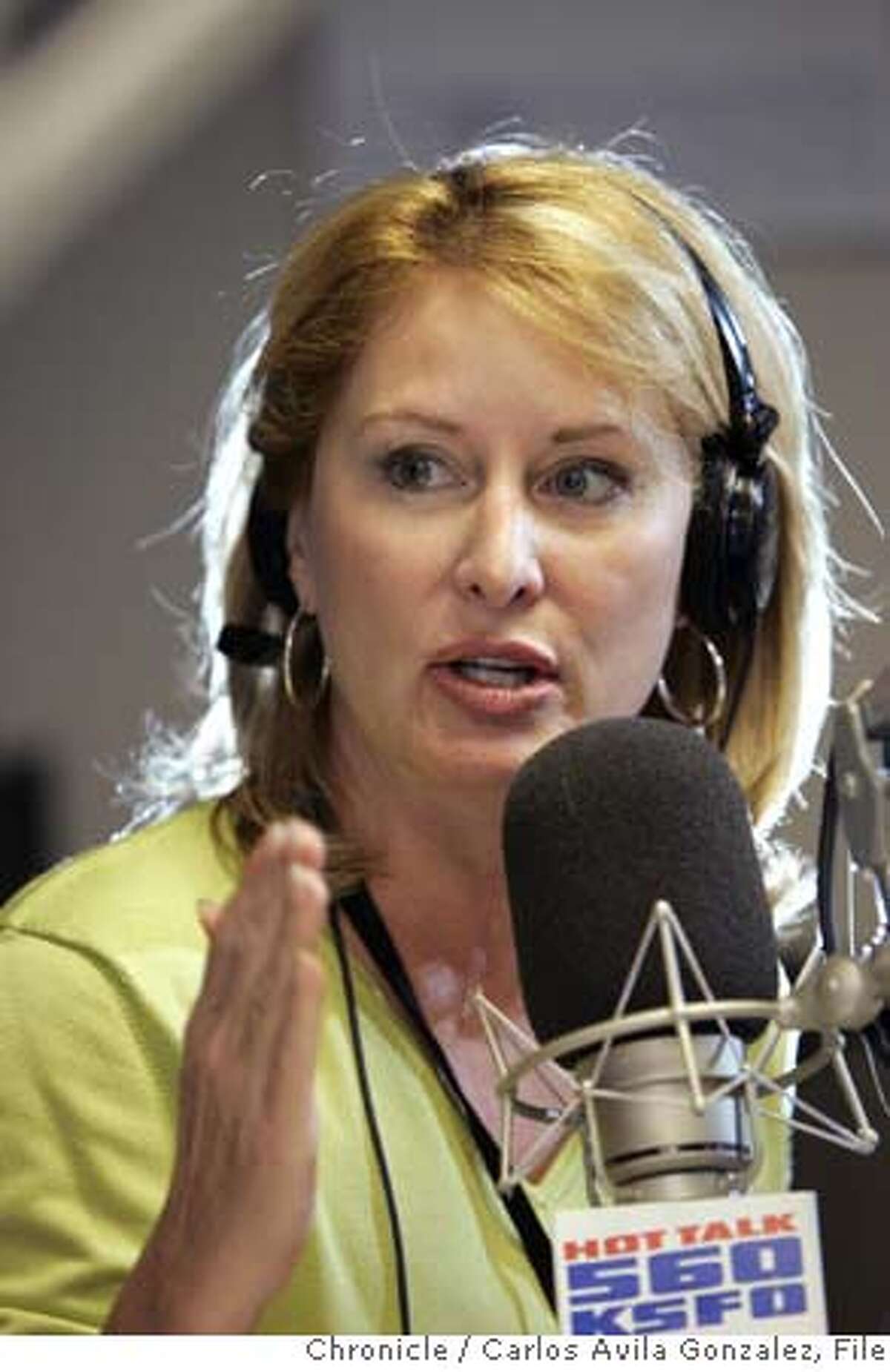 MORGANXX_042_CAG.TIF Melanie Morgan, a conservative talk show host on KSFO-AM. Until about a dozen years ago, she was a straight news reporter on KGO and elsewhere. But in the past couple of years, she's become a nationally-known activist, leading the charge to recall Gray Davis; running counter-protests to Cindy Sheehan; and being ripped by liberal media watchdog groups for calling for the death penalty for NYT editor Bill Keller, should he be tried for treason (for leaking confidential information.). She's a rarity -- a conservative activist living in Marin County. She's a recovering gambler (and subject of a made-for-TV movie); mother of a teen boy. This fall, she will release a book contrasting the lives of Sheehan and another family that lost a child in the war that's sure to fire up the troops on both sides of the red-blue divide. Photo by Carlos Avila Gonzalez/The San Francisco Chronicle Photo taken on 8/14/06, in San Francisco, Ca, USA **All names cq (roster) Ran on: 10-08-2006 Morgan at the mike from which she led the charge to recall Gov. Davis and rails against Spare the Air Day in the KSFO studios. MANDATORY CREDIT FOR PHOTOG AND SAN FRANCISCO CHRONICLE/ -MAGS OUT