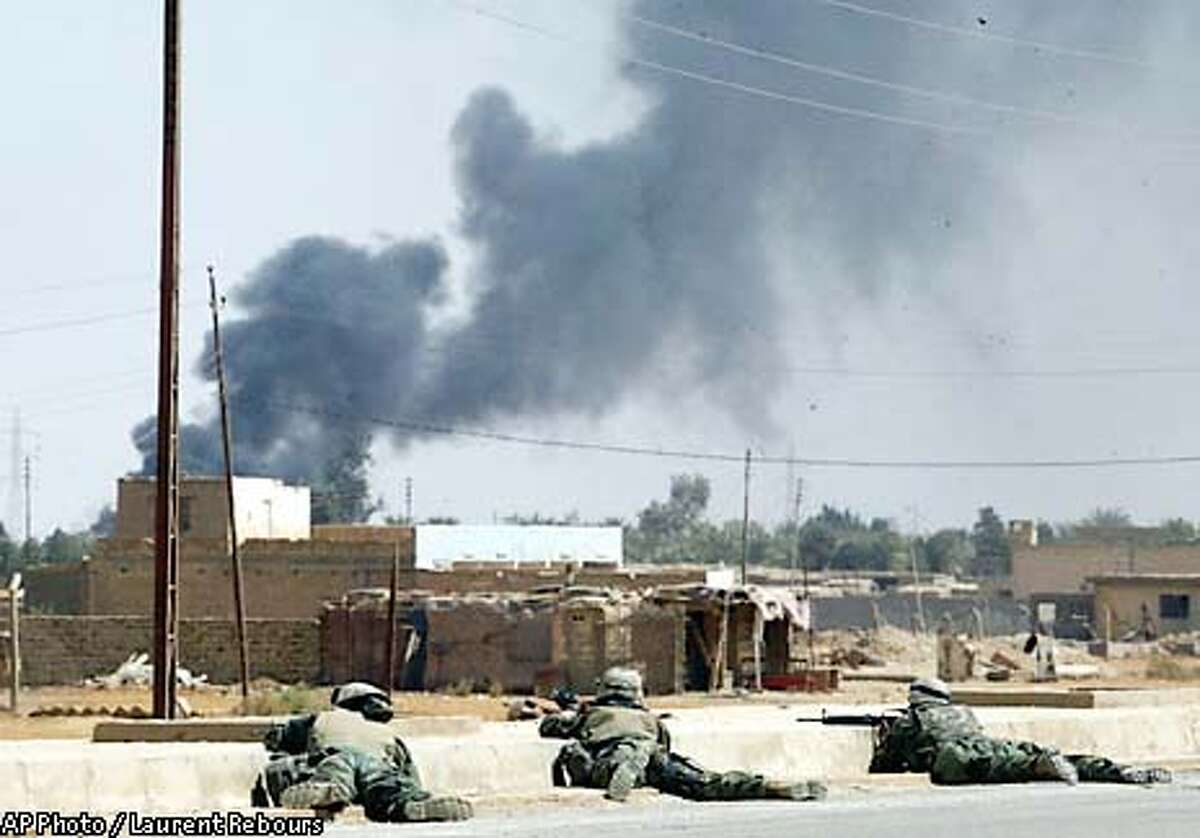 Tanks, troops battle for Baghdad airport / VISE TIGHTENS Bush sees
