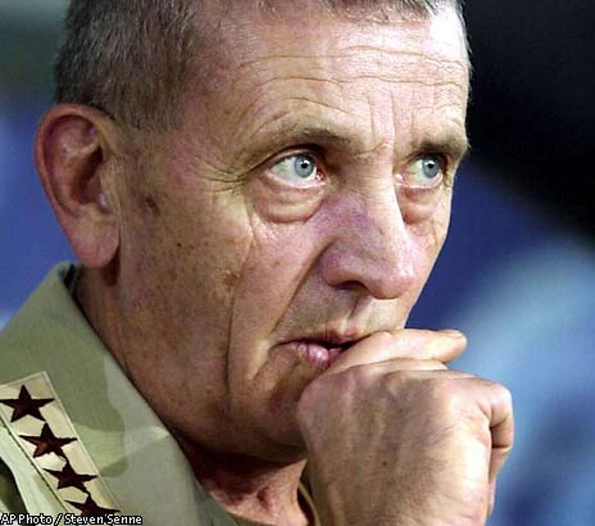 Gen. Tommy Franks, Commander of U.S. Central Command, listens to a question during a news conference at the Coalition Media Center, at Camp As Sayliyah, in Doha, Qatar, Saturday, March 22, 2003. Franks spoke about the progress in the war on Iraq. (AP Photo / Steven Senne)