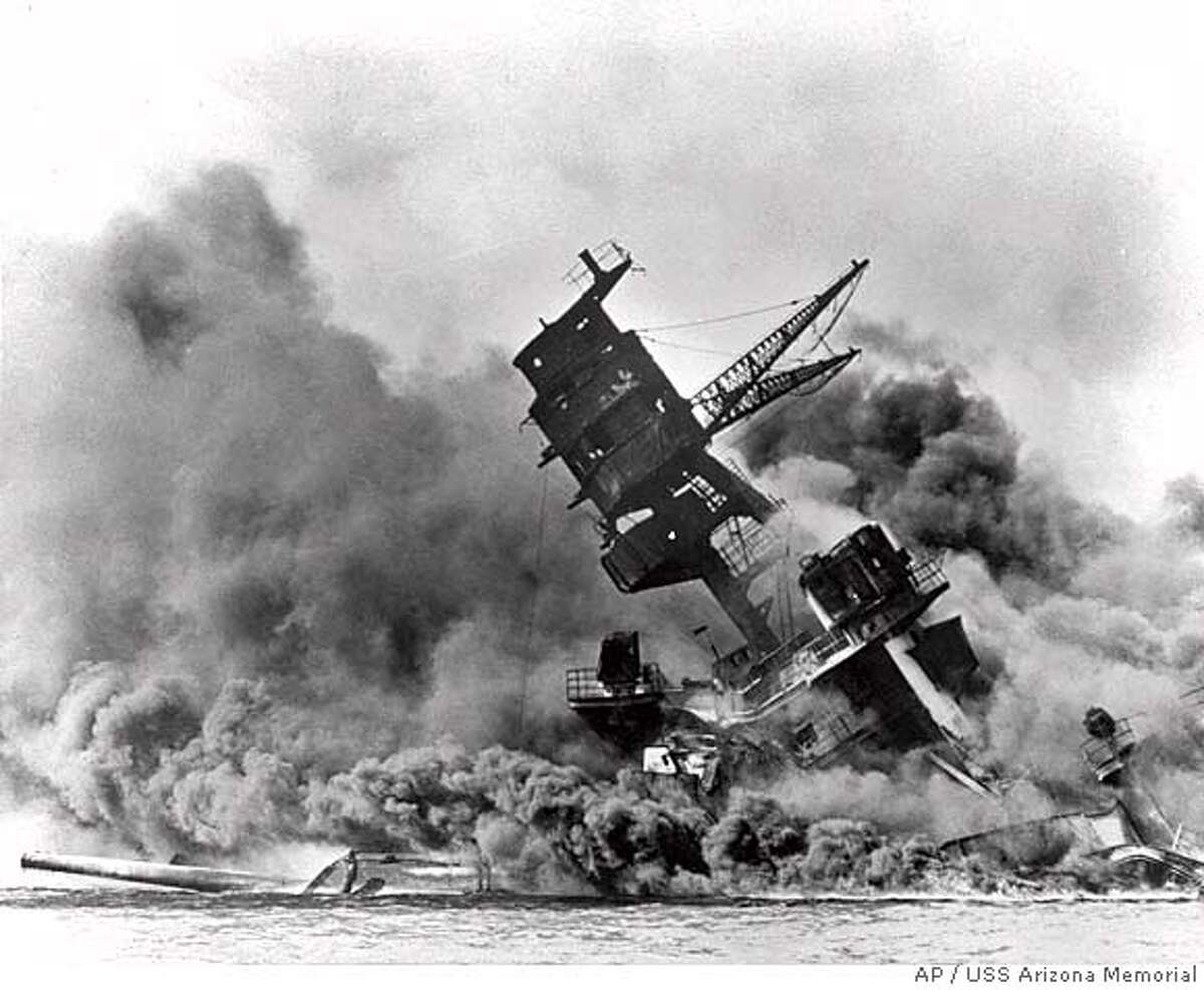 ADVANCE FOR WEEKEND EDITIONS DEC. 1-2--FILE--Smoke rises from the USS Arizona as the ship sinks in this Dec. 7, 1941 black-and-white file photo from the attack on Pearl Harbor. The attacks of Sept. 11 briefly halted sports. It was not the first time sports has felt the impact of world affairs. Sixty years ago this week, Japanese planes bombed Pearl Harbor, plunging the United States into World War II. (AP Photo/USS Arizona Memorial), Also appeared 12/06/02 Ran on: 07-04-2004 The battleship Arizona sinks in the Pearl Harbor attack, which prompted creation of the CIA. CAT
