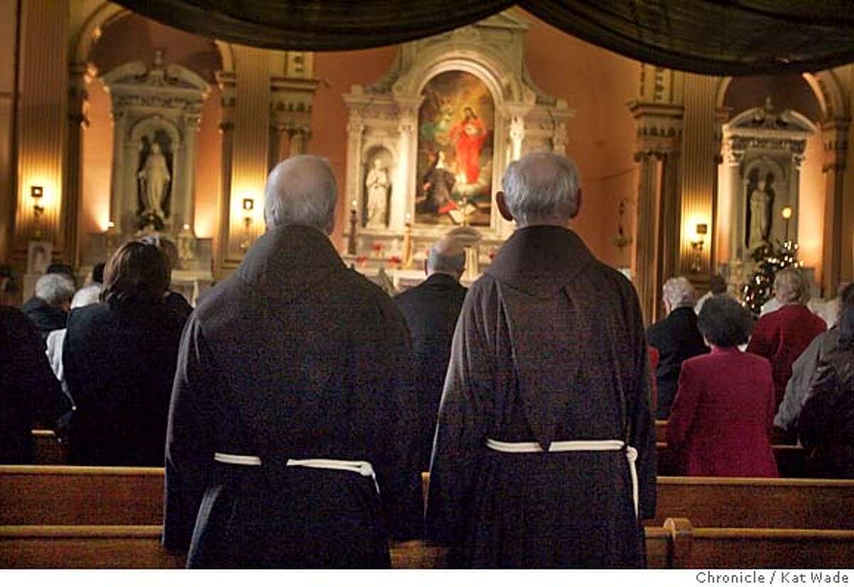 LASTMASS27_071_KW.jpg On 12/26/04 in San Francisco Friars (LtoR) Brother Dennis Duffy and father Lewis Vitale listen as Pastor Paulinus Mangesho celebrates the final Sunday Mass for Sacred Heart Church, an icon in the Western Addition for 107 years which is being closed because the Roman Catholic archdiocese is not willing to part with the 8 million dollars required to retrofit the crumbling edifice. Most parishners and the Sacred Heart Gospel Choir wil be moving to the friar's church, St. Boniface. Chronicle Photo by Kat Wade Mags out/mandatory credits San Francisco Chronicle and photographer/