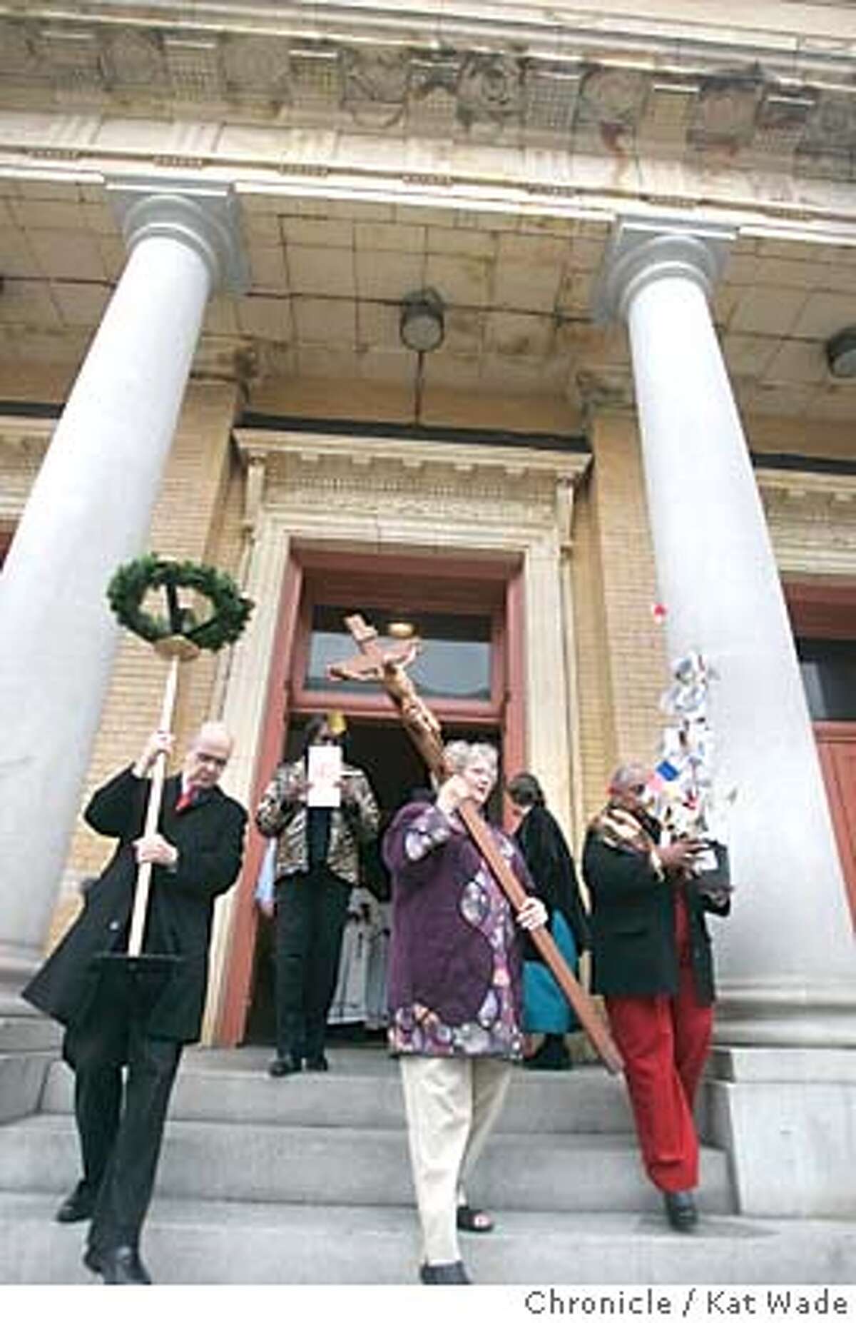 LASTMASS27_223_KW.jpg On 12/26/04 in San Francisco Cross Bearer, Norma Dahnken (CENTER) ceremoniously leads the congregation out of Sacred Heart Church for the last time after Pastor Paulinus Mangesho celebrated the final Sunday Mass for Sacred Heart Church, an icon in the Western Addition for 107 years which is being closed because the Roman Catholic archdiocese is not willing to part with the 8 million dollars required to retrofit the crumbling edifice. Chronicle Photo by Kat Wade Mags out/mandatory credits San Francisco Chronicle and photographer/