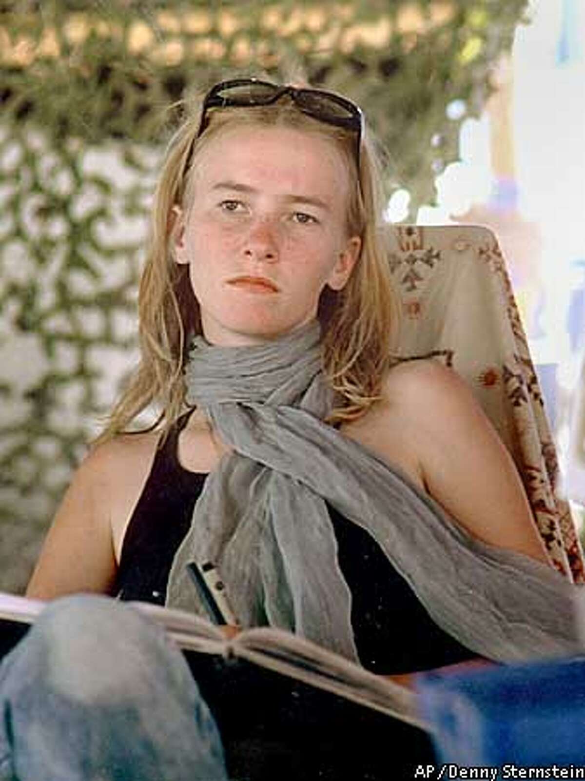 Peace activist Rachel Corrie is shown at the Burning Man festival in a photo from September 2002, in Black Rock City, Nev. Corrie, 23, a student at The Evergreen State College in Olympia, Wash., died Sunday, March 16, 2003, in the Gaza Strip city of Rafah while trying to stop a bulldozer from tearing down a Palestinian physician's home. She fell in front of the machine, which ran over her and then backed up, witnesses said. Israeli military spokesman Capt. Jacob Dallal called her death an accident. State Department spokesman Lou Fintor said the U.S. government had asked Israeli officials for a full investigation. (AP Photo/Denny Sternstein)