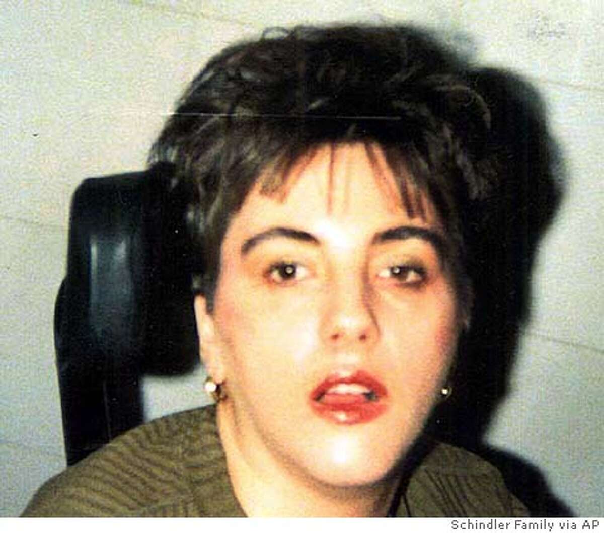 **FILE** Terri Schiavo is shown in this undated Schindler family photo taken shortly after she had a heart attack in 1990. The medical examiner's office plans to release its autopsy report Wednesday on Terri Schiavo _ findings her family hopes will shed light on the cause of the collapse that left her severely brain-damaged 15 years ago. Schiavo, 41, died March 31, nearly two weeks after the feeding tube that had kept her alive was removed under a court order obtained by her husband, Michael Schiavo. (AP Photo/Schindler Family Photo, File) ** **