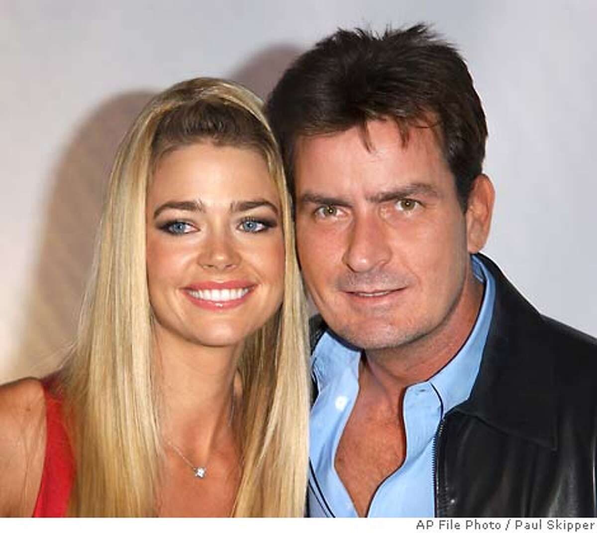 ** FILE ** Denise Richards and husband Charlie Sheen are shown at the "Rodeo Drive Walk Of Style" in this Sept. 9, 2003 file photo, in Beverly Hills, Calif. (AP Photo/Paul Skipper, File)