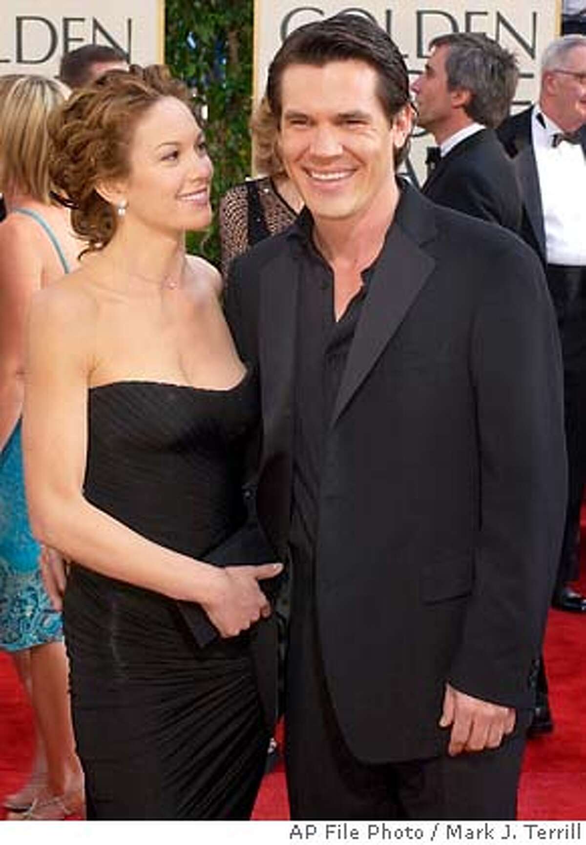 **FILE**Diane Lane arrives with then-boyfriend Josh Brolin at the Golden Globe Awards, in Beverly Hills, Calif., on Jan. 19, 2003. Brolin was cited for misdemeanor domestic battery over the weekend after Lane, now his wife, called police during an argument at the couple's home. Brolin was arrested around 3 a.m. Sunday, Dec.19, 2004, and released on $20,000 bail, Frank Mateljan, a spokesman for the city attorney's office, said Monday.(AP Photo/Mark J. Terrill)