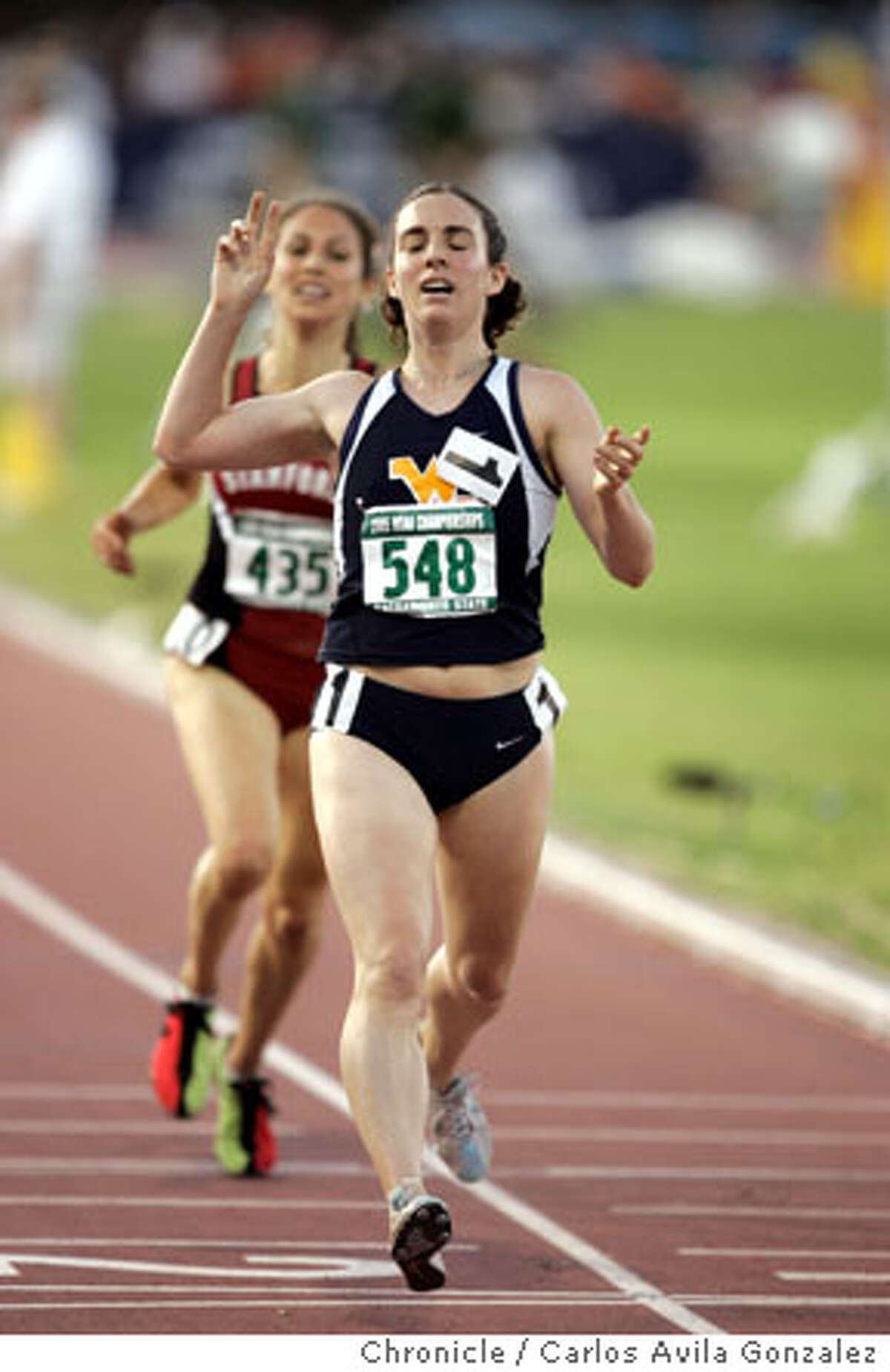 NCAA TRACK AND FIELD Division I Championships / Hall beats teammate in