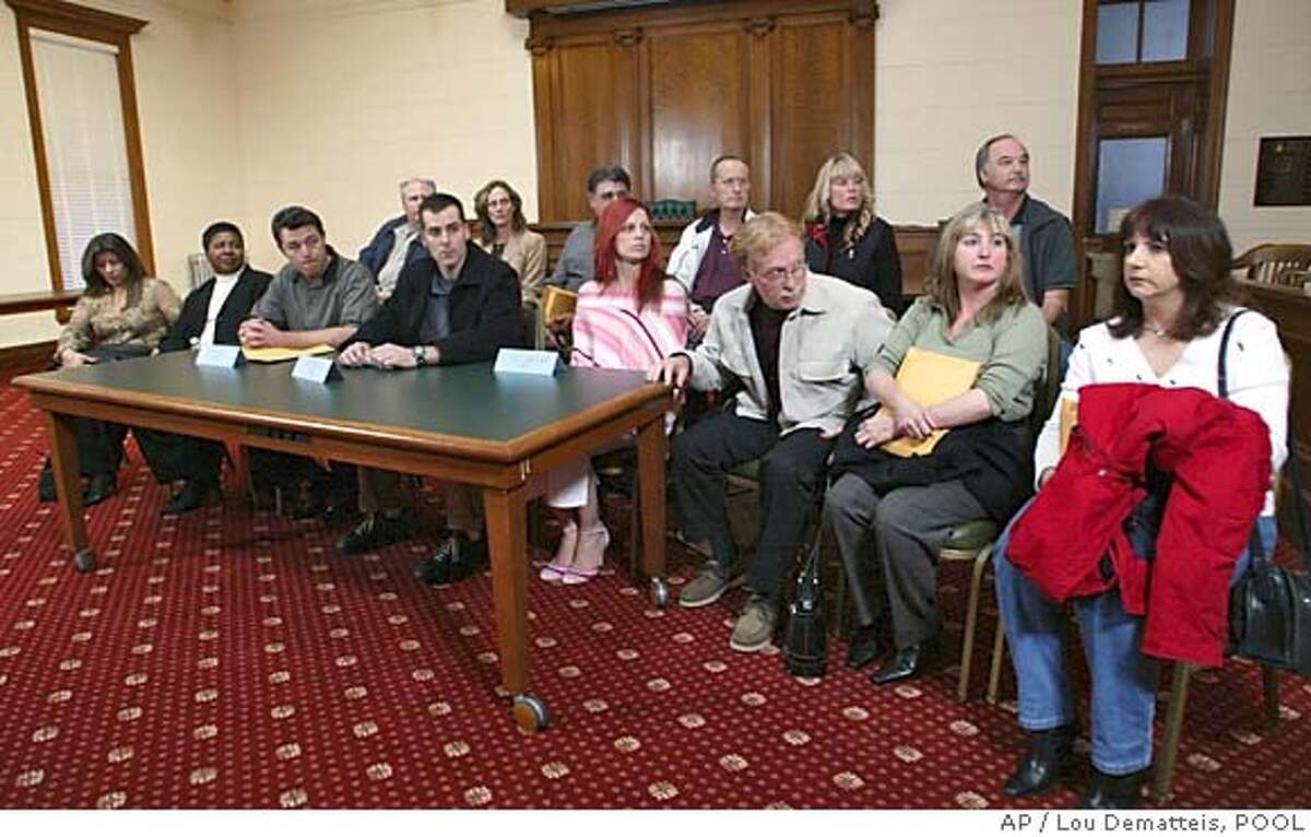 ** RETRANSMITTING TO ADD IDS ** Members of the jury are seen after they read a statement during a news conferece in Redwood City, Calif., Monday, Dec. 13, 2004. The jury returned with a sentence recommendation of death in the penalty phase of the Scott Peterson case. Peterson was convicted of two counts of murder in the deaths of his wife Laci Peterson and their unborn child. Seen are, from left to right in the front row, Lorena Gonzalez, Fairy Sorrell, Greg Beraltis, Steve Cardosi, Richelle Nice, Dennis Lear, Mary Mylett and an unidentified alternate. Seen in the back row are John Guinasso, Julie Zanartu, Tom Marino, an unidentified alternate, Kristy Lamore and Michael Belmessieri. (AP Photo/ Lou Dematteis, POOL)
