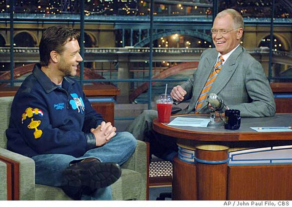 In this handout photo released by CBS, actor Russell Crowe, left, talks to host David Letterman on CBS's "The Late Show with David Letterman," Wednesday, June 8, 2005, in New York. A chagrined Crowe apologized on the show for throwing a telephone at a hotel concierge earlier this week, saying he reacted poorly to being a lonely family man away from home. The Australian actor told David Letterman that it was possibly the most shameful situation he'd ever gotten himself in his life. Crowe was arrested Monday for allegedly throwing a malfunctioning telephone at Mercer Hotel concierge Nestor Estrada while trying unsuccessfully to make a phone call to his wife in Australia. (AP Photo/John Paul Filo, CBS)