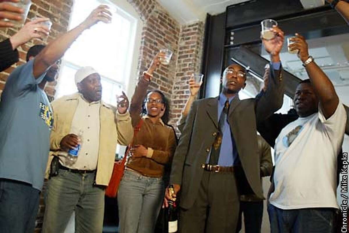 During a press conference, m,embers of the Baker Center for Human Rights in San Francisco make a toast celebrating the indictments made in the San Francisco Police department. BY MIKE KEPKA/THE CHRONICLE