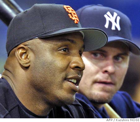 Former New York Yankee Jason Giambi talks to reporters during Old