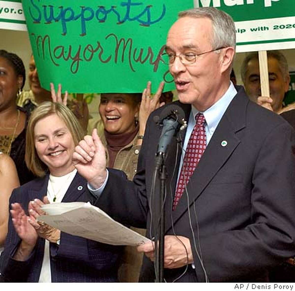 San Diego Mayor Dick Murphy, right, speaks as his wife Jan Murphy, left, looks on at a news conference Friday Nov. 19, 2004, in San Diego, announcing victory over his opponents, write-in candidate Donna Frye and Ron Roberts, in the San Diego mayors race. Murphy made his announcement after the San Diego registrar of voters finished the vote count with Murphy in the lead. His campaign still faces lawsuits challenging the election. (AP Photo/Denis Poroy) Metro#Metro#Chronicle#11/23/2004#ALL#5star#b2#0422476270