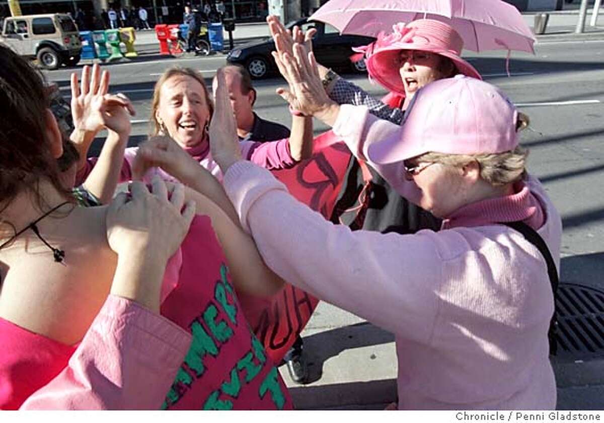 AUTO226PG.JPG Medea Benjamin in center, after marching thru the auto show, these ladies from code pink congradulate each other as they just heard they will not be arrested for standing ontop of a hummer. SF Auto show at Moscone ctr. and demo by those seeking fuel effecient cars Photo taken by Penni Gladstone/The San Francisco Chronicle Photo taken on 11/22/04, in San Francisco, CA. Metro#Metro#Chronicle#11/22/2004#ALL#5star##0422479165