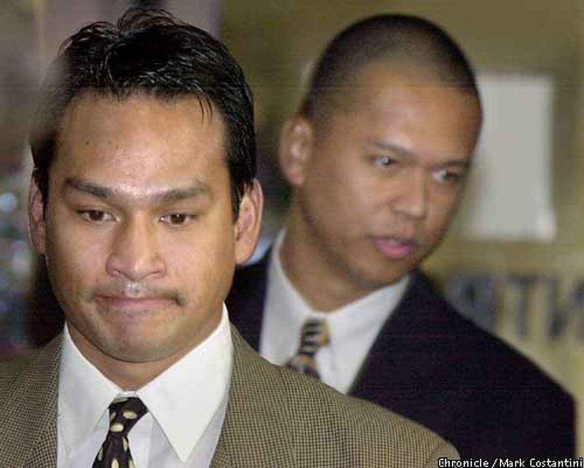 RIDERS07a-C-06DEC00-EZ-MC. (l-r) Jude Siapno and Clarence "Chuck" Mabanag, two Oakland cops known as "The Riders" enter the Alameda County Superior Court in Oakland today. Photo by Mark Costantini/Chronicle ALSO RAN 5/31/2001