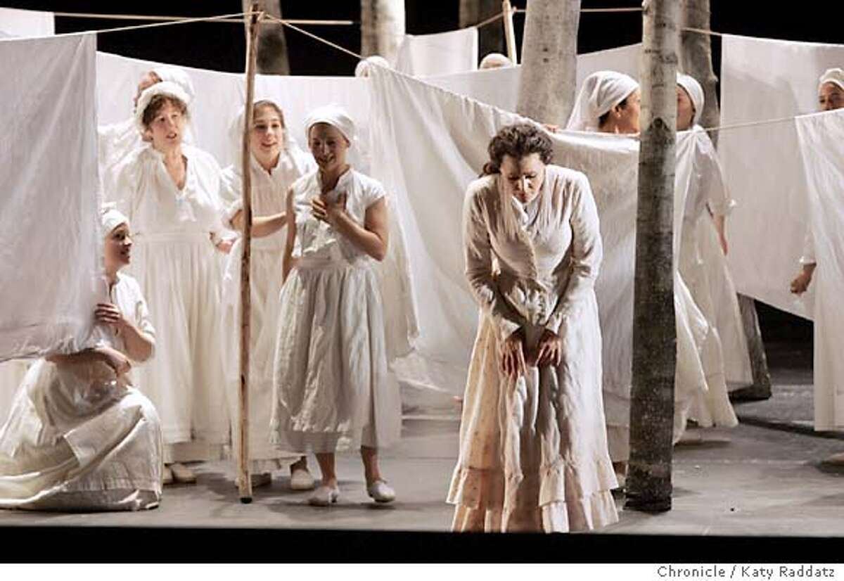 ONEGIN_rad.jpg San Fraqncisco Opera presents Tchaikovsky's "Eugene Onegin." SHOWN: Tatiana is in the foreground, regretting the love letter she sent to Onegin, while the women of the chorus do the wash. Katy Raddatz / The Chronicle