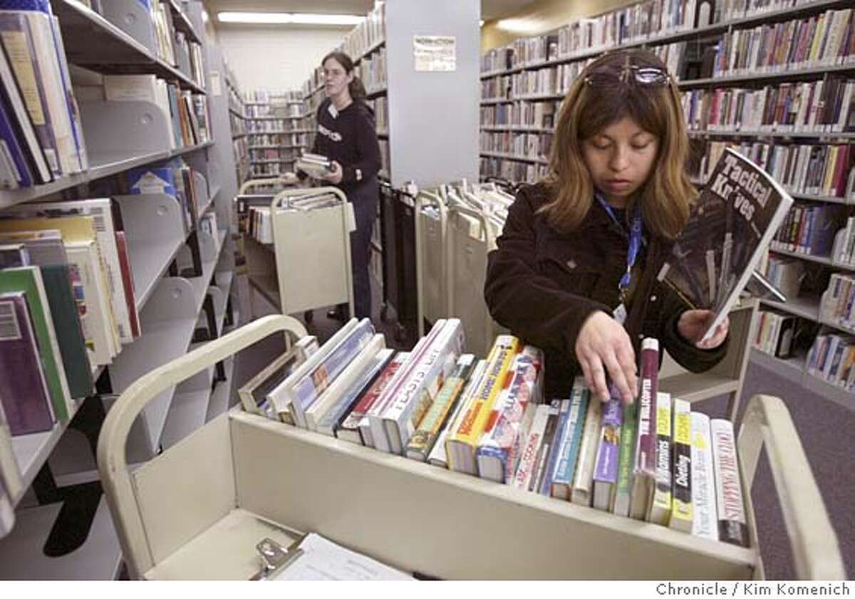 SALINASLIBRARY_051_kk.jpg Salinas Library pages Denise Cabrera (foreground) and Jamie Brown (background) reshelve books in the main branch. Voters turned down measures that would have kept the financially stressed Salinas libraries open. Consequently, the libraries are scheduled to close after the first of the year unless the public finds a way to keep them open. Photo by Kim Komenich in Salinas. Metro#Metro#Chronicle#11/20/2004#ALL#5star#a15#0422475498