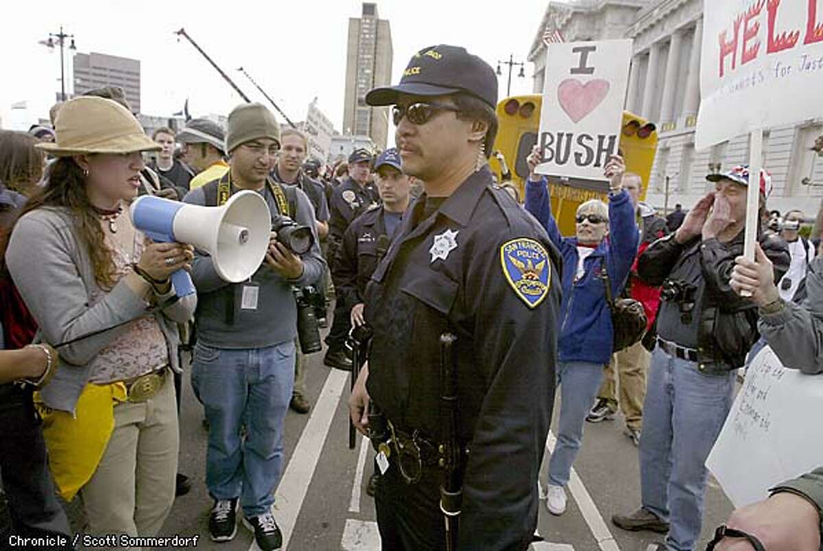 San Francisco police stood between a small band of pro-Bush supporters and antiwar types at City hall sunday. By Scott Sommerdorf/Chronicle