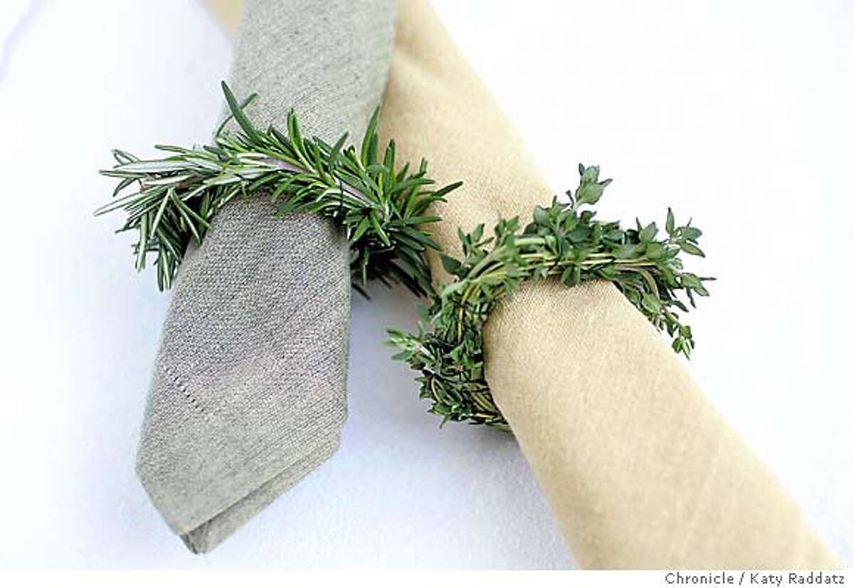 NAPKIN24_rad.jpg Story is about last minute Thanksgiving table settings. SHOWN: napkin rings of fresh herbs. L to R: rosemary napkin ring, thyme napkin ring. On rolled linen napkins. Katy Raddatz / The Chronicle Ran on: 11-21-2004