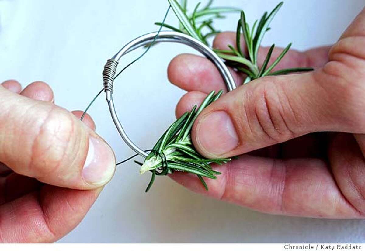 NAPKIN24_rad.jpg Story is about last minute Thanksgiving table settings. SHOWN: napkin rings of fresh herbs. STEP FOUR: wire herb stem to wire form with florist wire. Katy Raddatz / The Chronicle