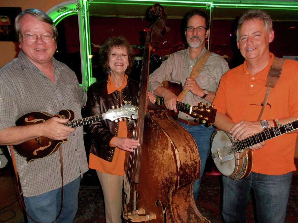 Mandolin and fiddle master Hank Harrison, from left, pauses between sets with other Tennessee Valley Authority members Mary Ann Cornelius, Mark Maniscalco and Don Van Winkle.