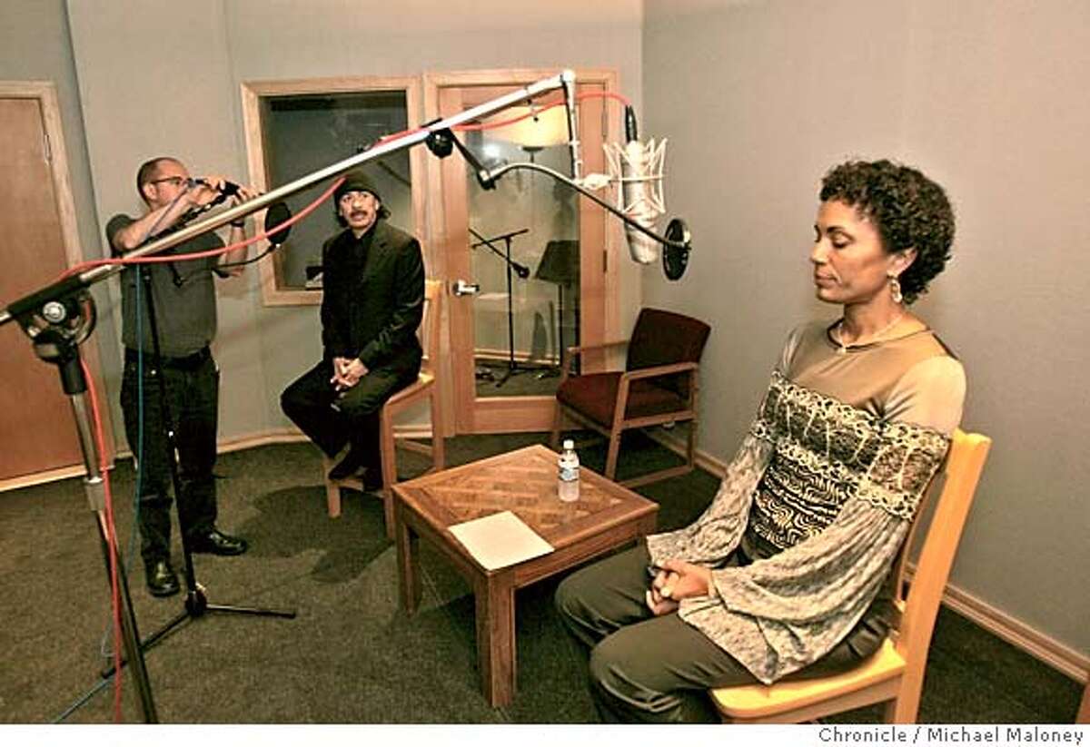 SANTANA_ 3_MJM.jpg Deborah Santana closes her eyes to collect her thoughts as a sound technician works on Carlos' mic stand prior to recording. Musician Carlos Santana sits in on a recording session for his wife Deborah Santana's new audio book, "Space Between the Stars : My Journey to an Open Heart". The book is autobiographical in nature and is due out next year along with the audio book. Both Carlos and Deborah were recording their thoughts on their marriage during this session at the Polarity recording studios in SF. Photo by Michael Maloney / San Francisco Chronicle MANDATORY CREDIT FOR PHOTOG AND SF CHRONICLE/ -MAGS OUT Datebook#Datebook#Chronicle#11/22/2004##Advance##0422403368