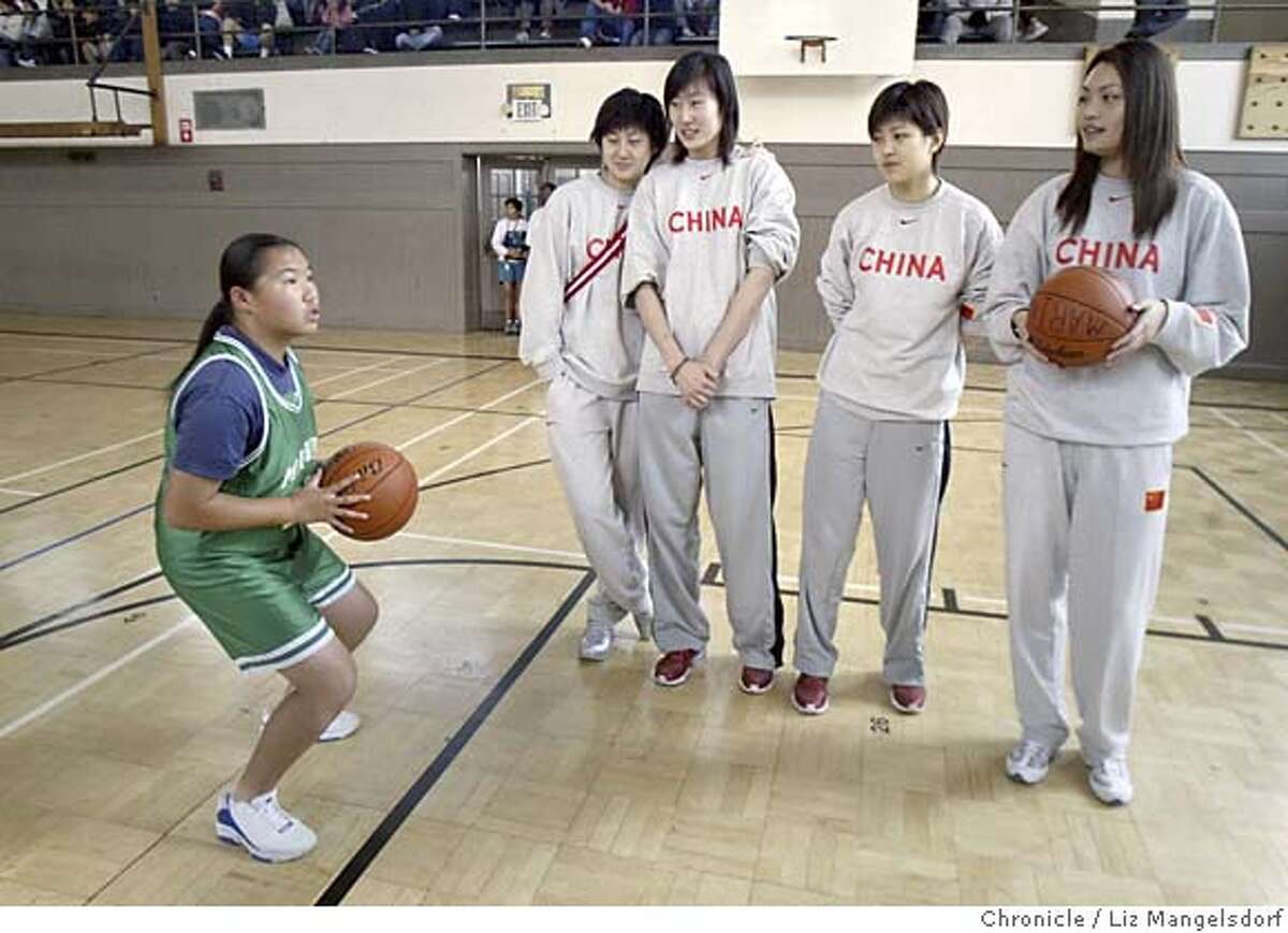 chinesenationalteam026_lm.JPG Event on 5/9/05 in San Francisco. Members of the Chinese National Women's Team watches Vanessa lam of the Marina Middle School shoot a free throw. The Chinese national women's basketball team payhs a visit to Marina Middle School and shoots some hoops with the kids. China's women's basketball team is in the bay area after playing an exhibition game against the WNBA's Sacramento Monarchs. Liz Mangelsdorf / The Chronicle MANDATORY CREDIT FOR PHOTOG AND SF CHRONICLE/ -MAGS OUT