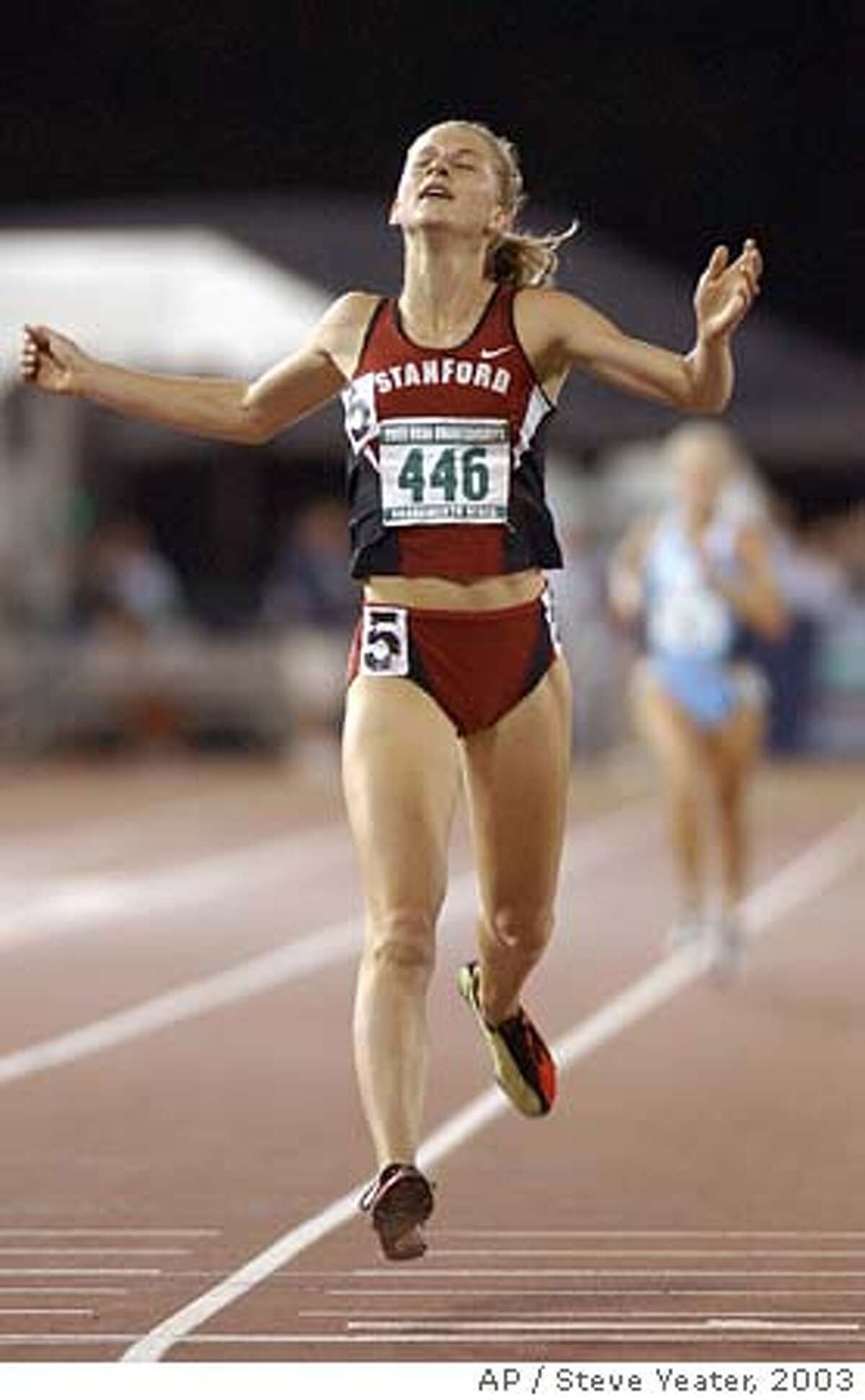 Stanford's Lauren Fleshman crosses the finish line to win the women's 5,000 meters with a time 15:24.06 during the NCAA track and field championships in Sacramento, Calif., Saturday, June 14, 2003. (AP Photo/Steve Yeater) CAT