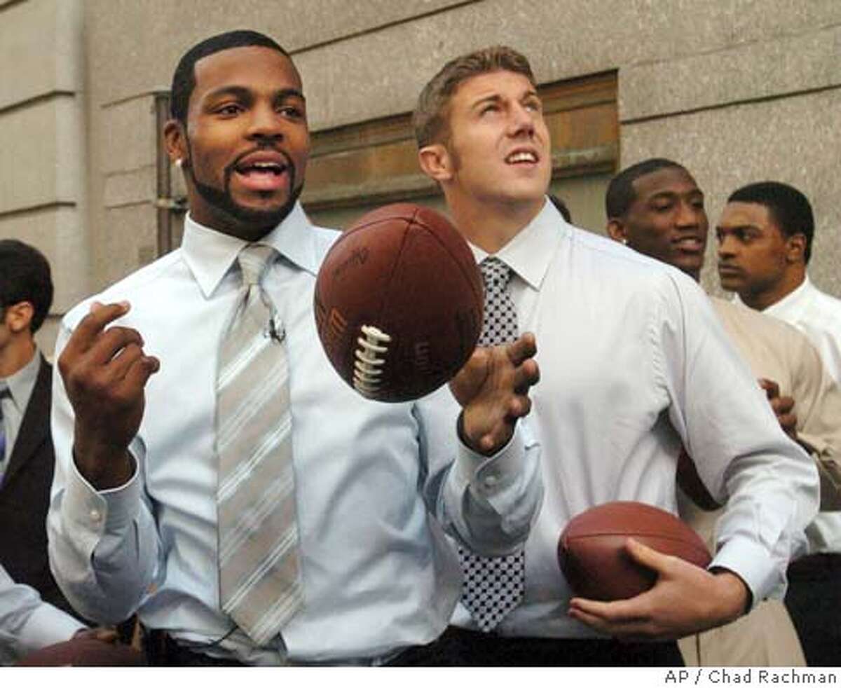 Utah quarterback Alex Smith, left, holds up a San Francisco 49ers jersey  with NFL commissioner Paul Tagliabue after the 49ers selected him as the  No. 1 overall pick in the NFL Draft