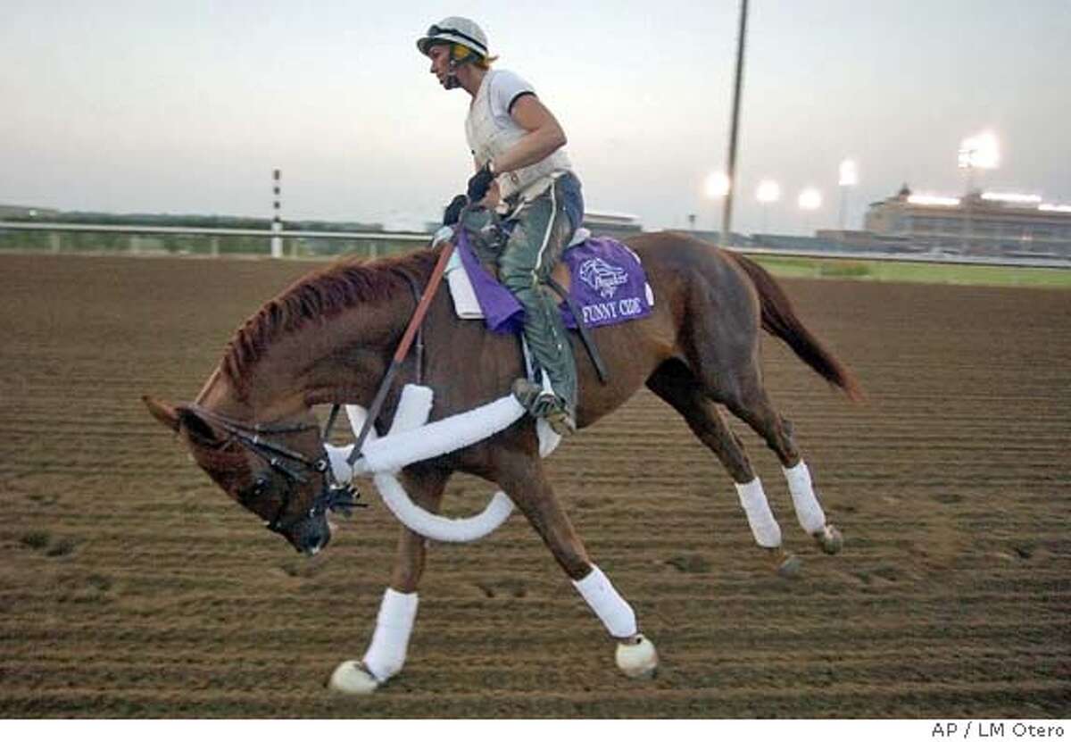 Funny Cide takes a turn with practice rider Robin Smullen during the early moring workout at Lone Star Park in Grand Prairie, Texas, Friday, Oct. 29, 2004, in preparation for the Breeders' Cup Classic Saturday. (AP Photo/LM Otero) Sports#Sports#Chronicle#10/30/2004#ALL#5star##0422439156