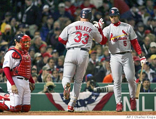 Boston Red Sox pitcher Keith Foulke and catcher Jason Varitek hug after the  last out of game one of the World Series against the St. Louis Cardinals in  Boston, Saturday, Oct. 23