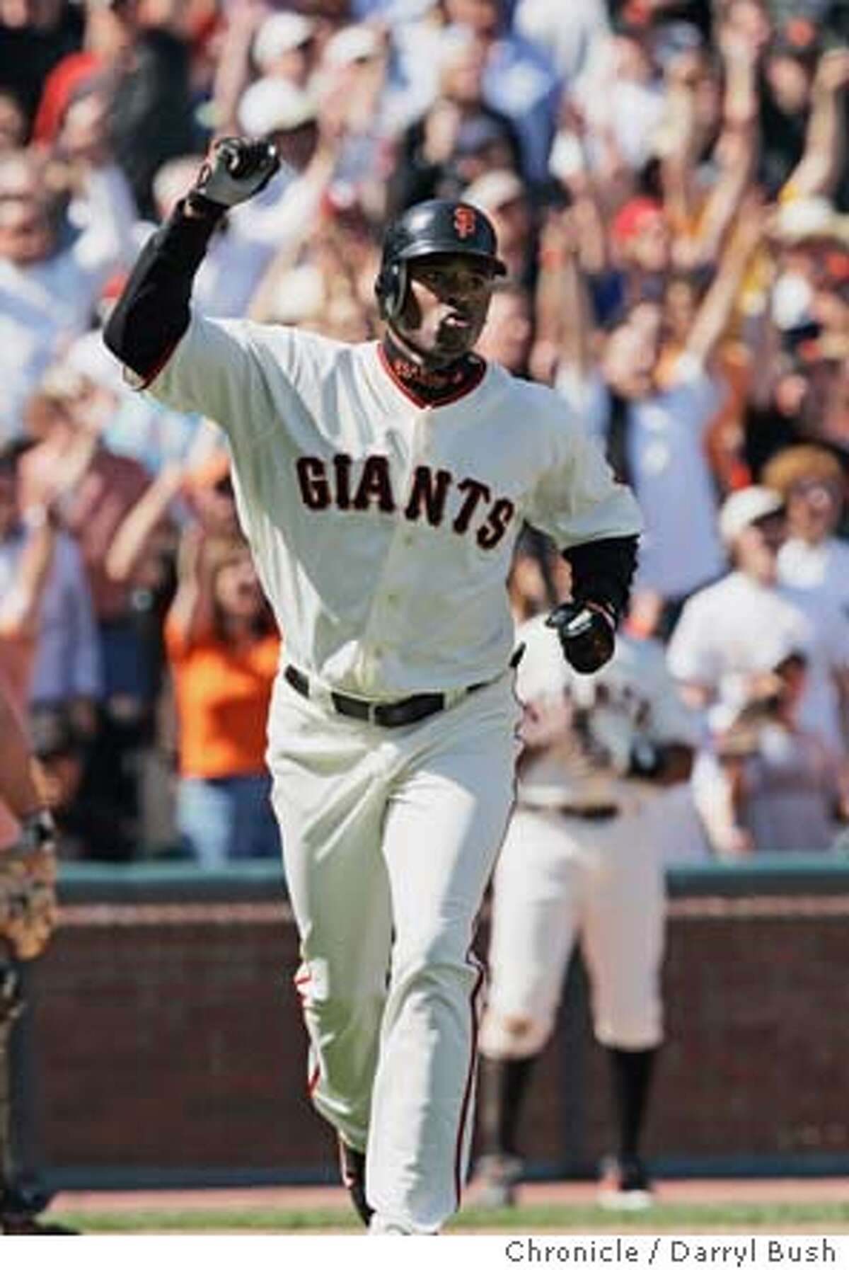 San Francisco Giants Michael Tucker celebrates after hitting a grand slam home run in the eighth inning vs. Colorado Rockies at SBC Park. Event on 4/9/05 in San Francisco. Darryl Bush / The Chronicle