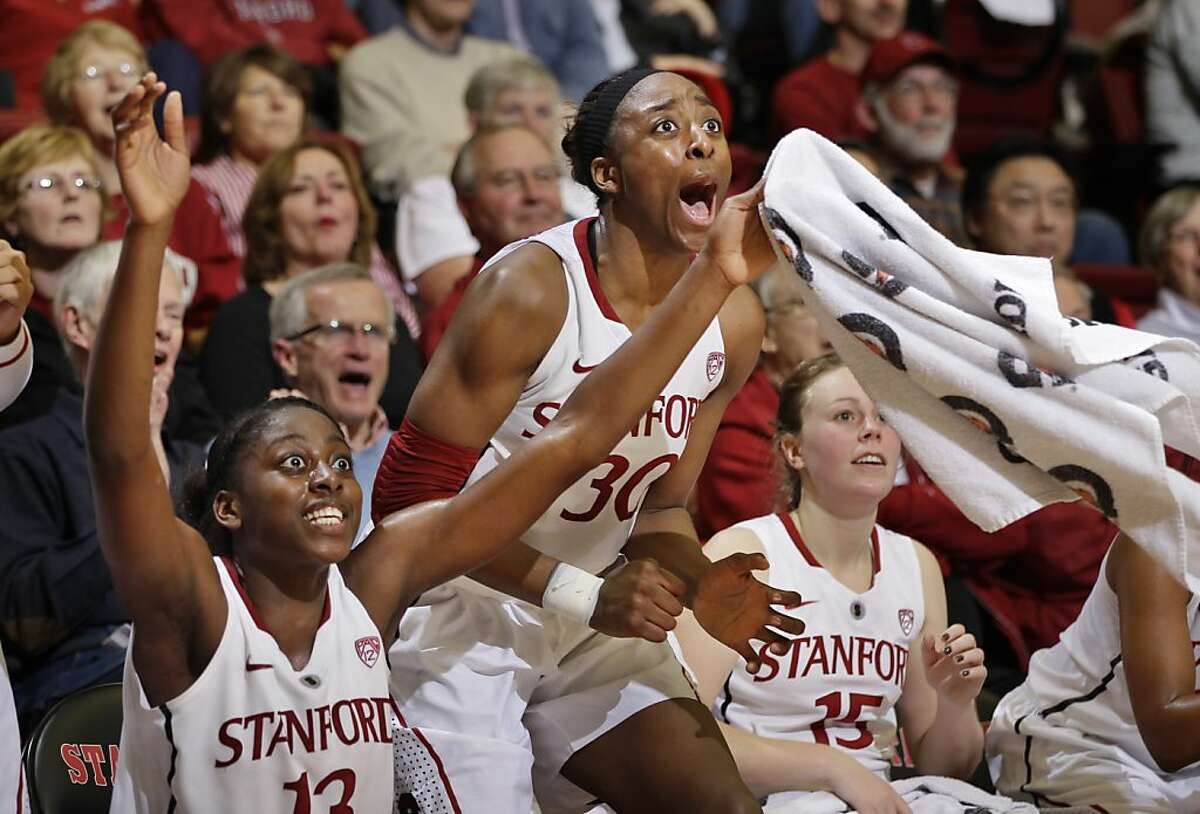 Stanford forwards Nnemkadi Ogwumike (30) and Chiney Ogwumike (13) celebrate late in the second half of an NCAA college basketball game against Washington State in Stanford, Calif., Thursday, Jan. 19, 2012. Stanford defeated Washington State 75-41. (AP Photo/Paul Sakuma)