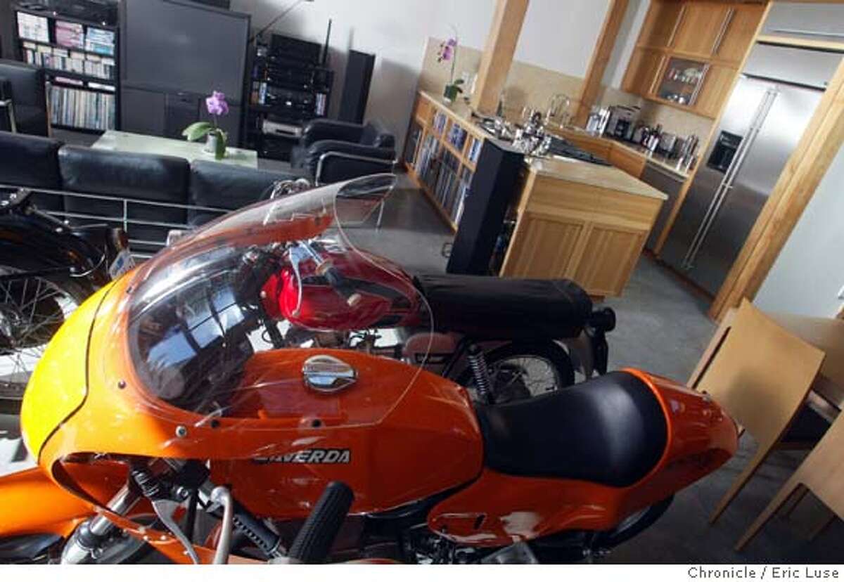 The Daylit Motorcycle Collection/Home/Design Firm: Synagogues and vintage Italian racing motorcycles meet in the live/work home of architect John Goldman. A San Francisco architect who specializes in synagogues, churches and homes, Goldman lives in a 1937 warehouse he converted into a loft to house his architecture office, living space, and museum-like collection of vintage Italian street and racing motorcycles that he collects and restores. Event on 3/8/04 in San Francisco. Eric Luse / The Chronicle