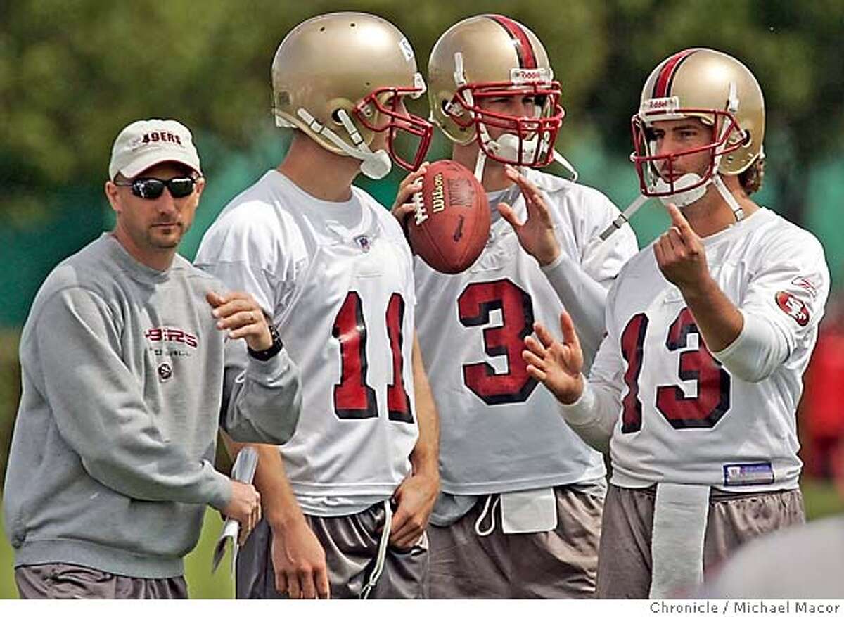49ers_231a_mac.jpg Quarterback coach- Jim Hostler with his QB's 11- Alex Smith, 3- Cody Pickett and 13- Tim Rattay. San Francisco Forty Niners hold a mandatory mini camp at their headquarters in Santa Clara.5/7/05 Santa Clara, Ca Michael Macor / San Francisco Chronicle Ran on: 05-08-2005 49ers QB coach Jim Hostler watches practice with three of his charges -- Alex Smith (11), Cody Pickett (3) and Tim Rattay (13). Ran on: 05-08-2005 49ers QB coach Jim Hostler watches practice with three of his charges -- Alex Smith (11), Cody Pickett (3) and Tim Rattay (13). Mandatory Credit for Photographer and San Francisco Chronicle/ NO Sales- Magazine Out