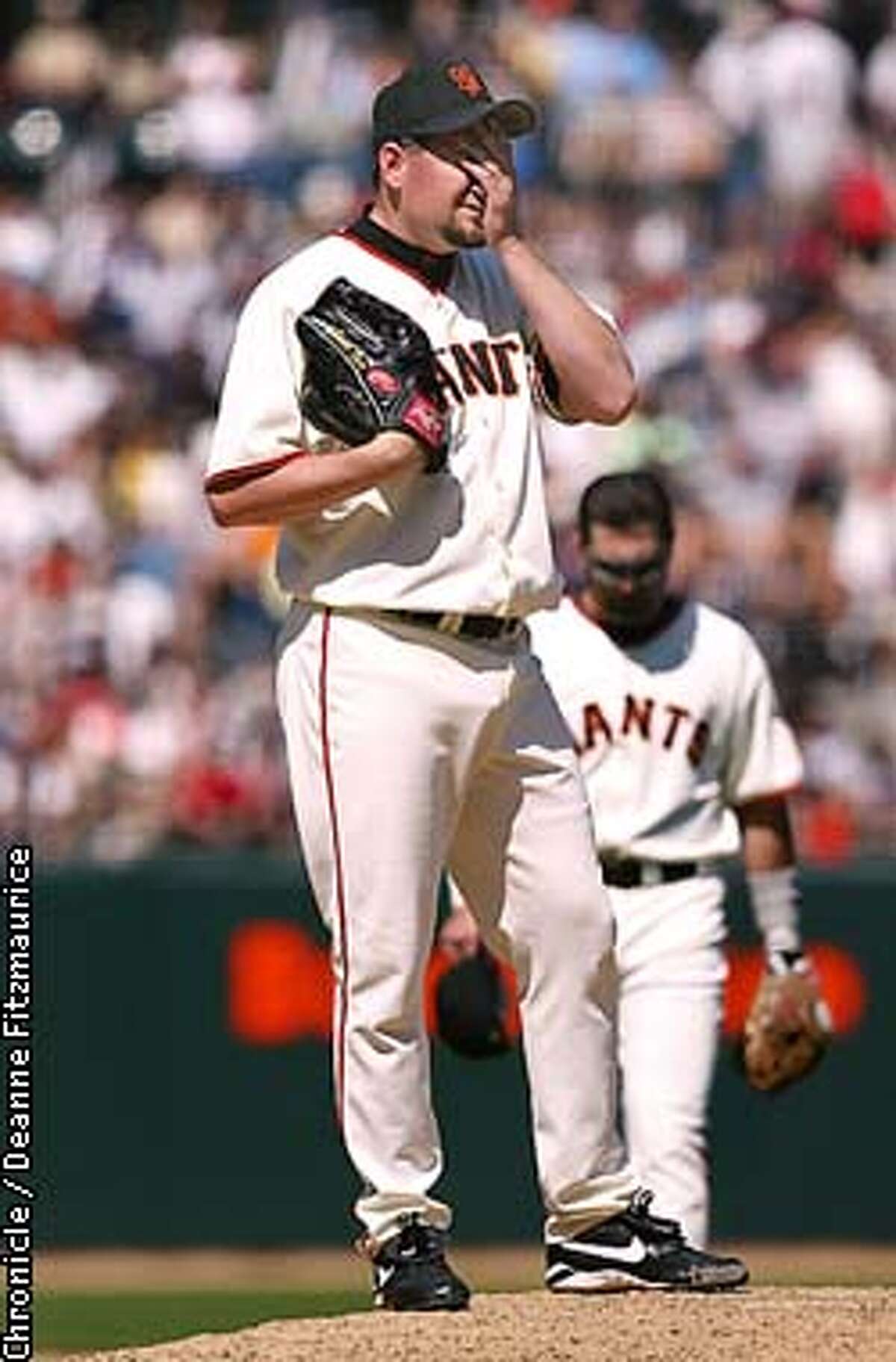 San Francisco Giants Neifi Perez congratulates Marquis Grissom after Grissom  hit a three run homer in