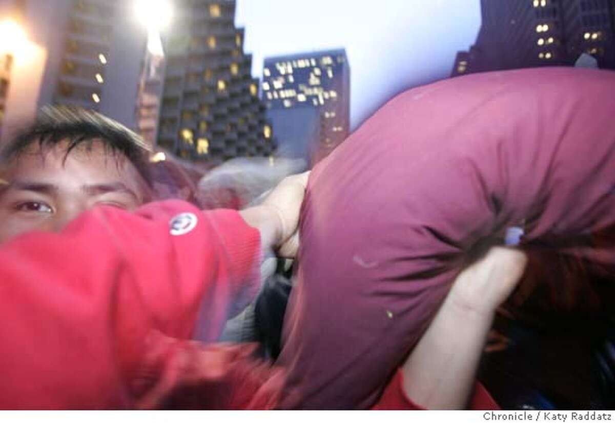 SHOWN: Annual Valentine's Day pillowfight in Justin Herman Plaza at dusk. These pictures were made on Wednesday, Feb. 14, 2007, in San Francisco, CA. (Katy Raddatz/SF Chronicle) **