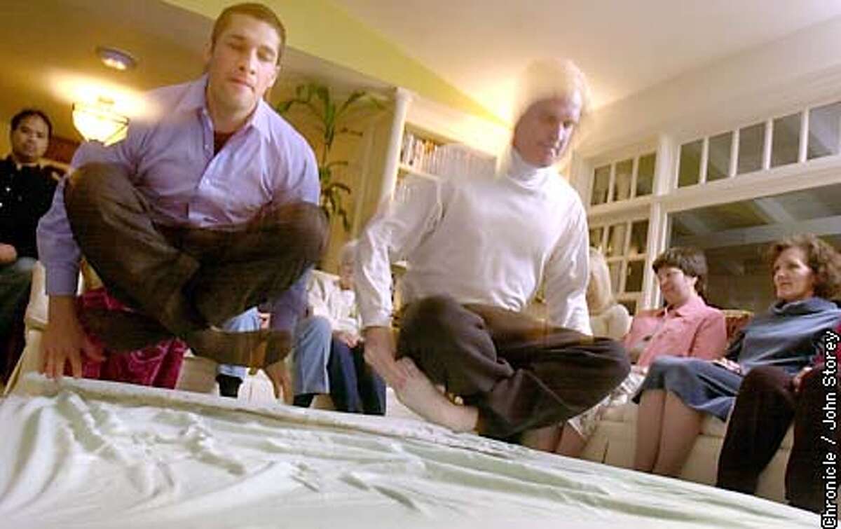 meditation040_jrs.jpg Enzo Olfati (blue shirt) and Joe Janlois demonstrate Yogic flying at the home of Janlois. Also a group in the living room of Valerie Janlois. 4/29/03 in Danville. JOHN STOREY / The Chronicle