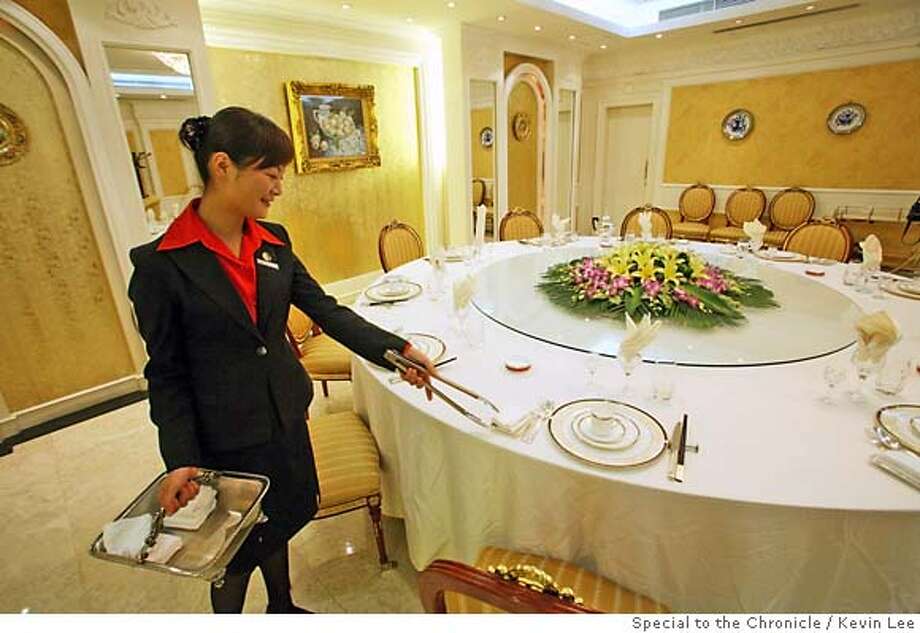 Dining High On The Hog For Chinese New Year Sfgate Chinese Servers Set Up Table At The Tianan Danzi Mian Restaurant In Shanghai On 19 September