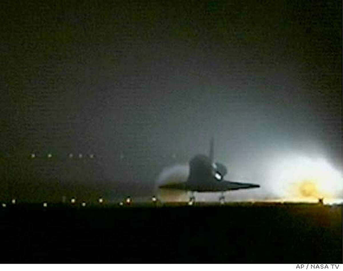 In this image from NASA television, the Discovery touches down safely on runway 22 at the Edwards Air Force Base in Calif. in this televised view Tuesday, Aug. 9, 2005. This is the 50th landing at Edwards Air Force Base. (AP Photo/NASA TV)