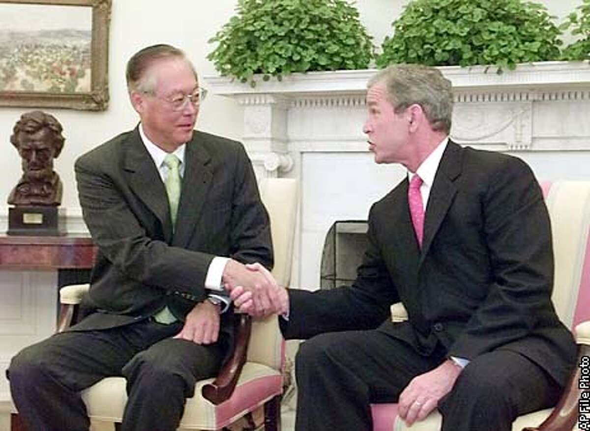 President Bush meets with Prime Minister Goh Chok Tong of Singapore in the Oval Office of the White House, Monday, June 11, 2001, in Washington. (AP Photo/Ron Edmonds)
