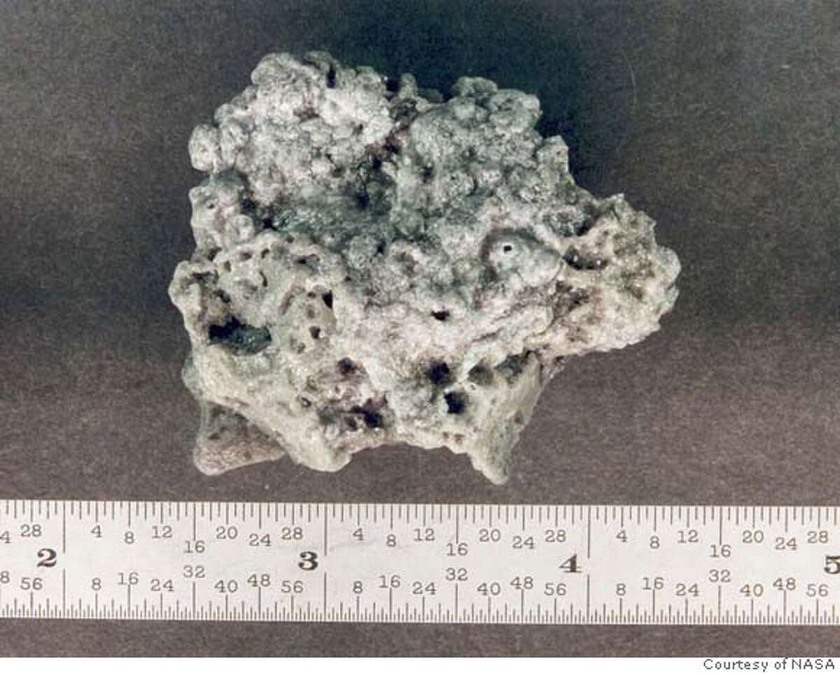 (NYT28) UNDATED -- Feb. 5, 2007 -- SCI-SPACE DEBRIS-3 -- A piece of solid rocket motor (SRM) slag. Aluminum oxide slag is a byproduct of SRMs. Orbital SRMs used to boost satellites into higher orbits are potentially a significant source of centimeter sized orbital debris. This piece was recovered from a test firing of a Shuttle solid rocket booster. (Courtesy of NASA Orbital Debris Program/The New York Times) *Editorial Use Only; Only for use with NYT story entitled SCI-SPACE DEBRIS By William J. Broad. All other use strictly prohibited. XNYZ -- *Editorial Use Only; Only for use with NYT story entitled SCI-SPACE DEBRIS By William J. Broad. All other use strictly prohibited.