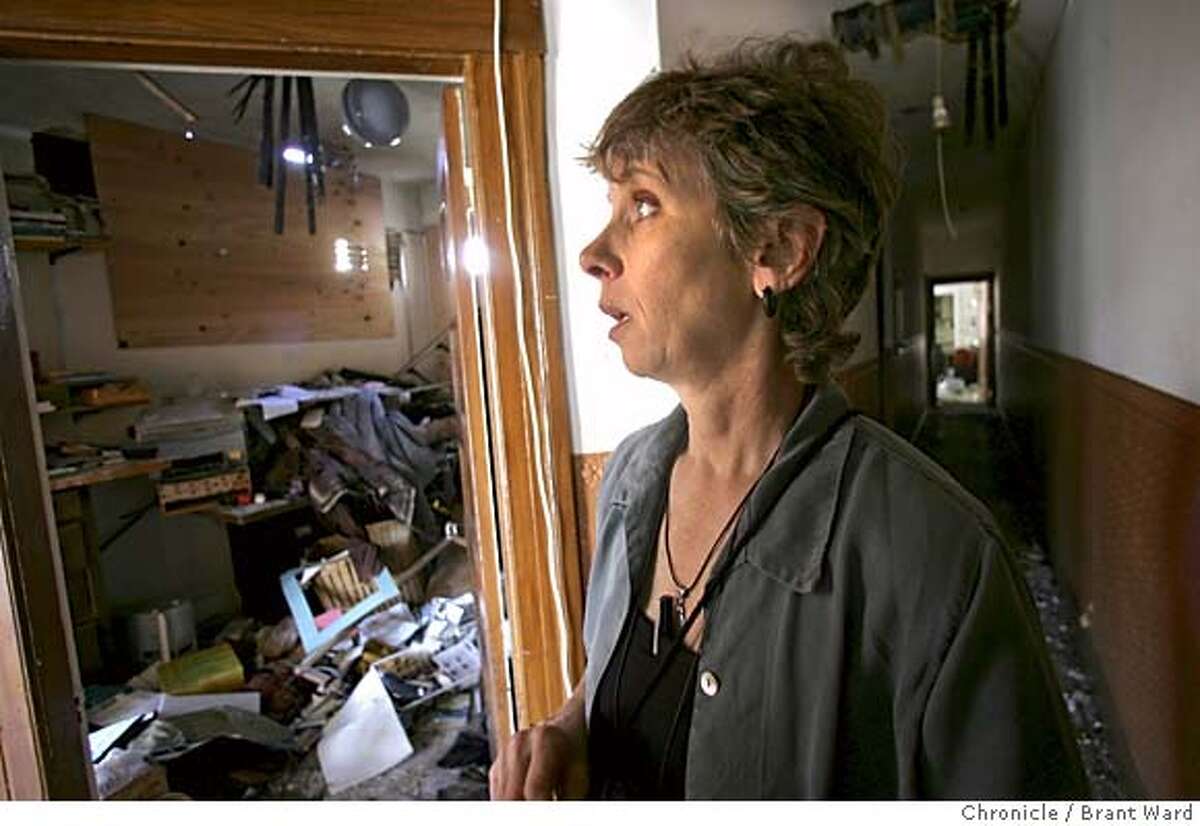 gjelten217_ward.jpg Elizabeth Gjelten takes a walk in her apartment hallway two weeks after a fire ruined her home. Elizabeth Gjelten is a San Francisco playwright whose work "What the Birds Carry" is being staged in Mountain View. A fire in her Mission district apartment on the night before her play opened, left her without her home. She is currently staying with friends. Brant Ward 7/26/05