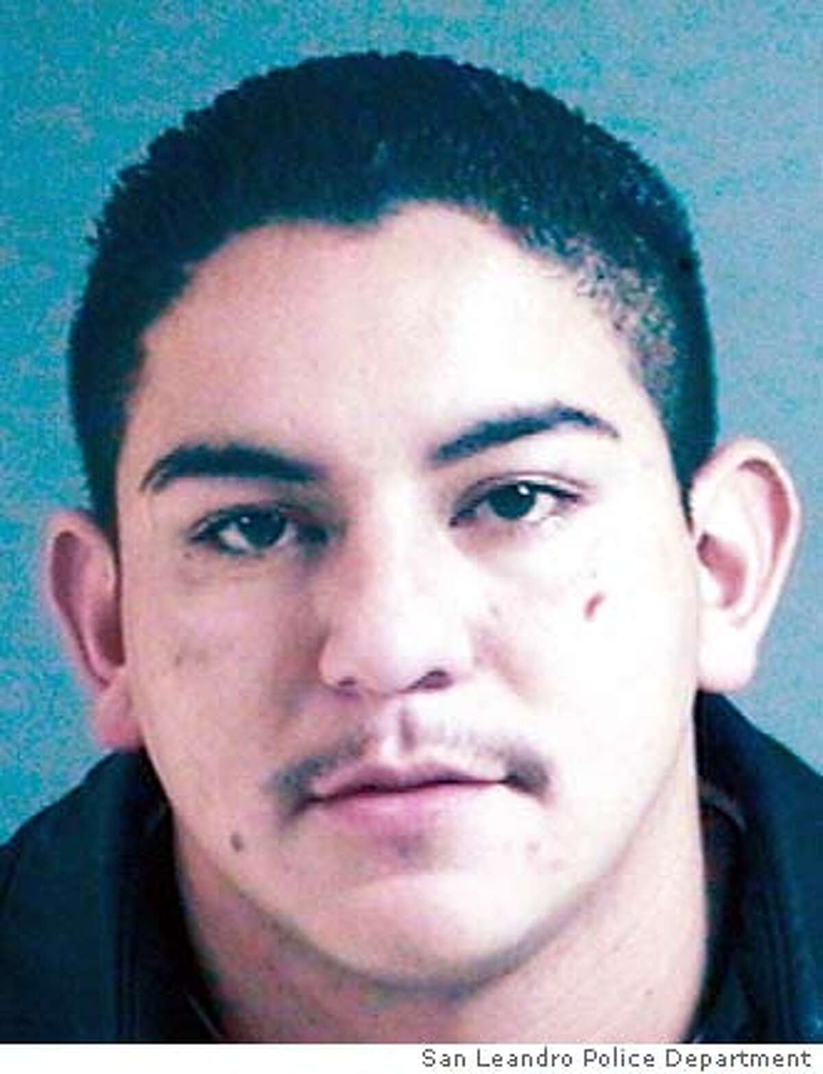 Copy of photo of Irving �Gotti� Ramirez, 23, of Newark, wanted for the murder of Officer Nels "Dan" Niemi. A statewide manhunt is under way this morning for a man who shot and killed San Leandro police officer Nels "Dan" Niemi Monday night in what investigators described as an unprovoked ambush. Police said they are looking for Irving �Gotti� Ramirez, 23, of Newark in connection with the city�s first killing of a police officer in recent memory. The 42-year-old officer, was shot shortly before 11 p.m. Monday in the 14700 block of Doolittle Drive in San Leandro.