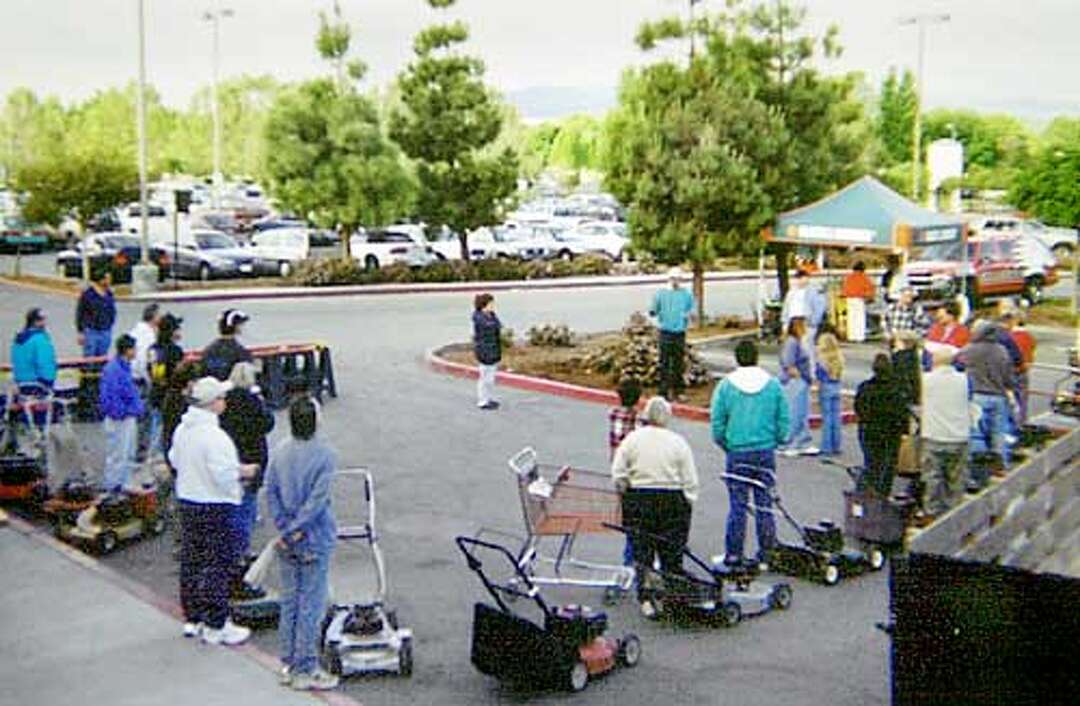 Cutting out the gas / Area rebate programs make electric lawn mowers